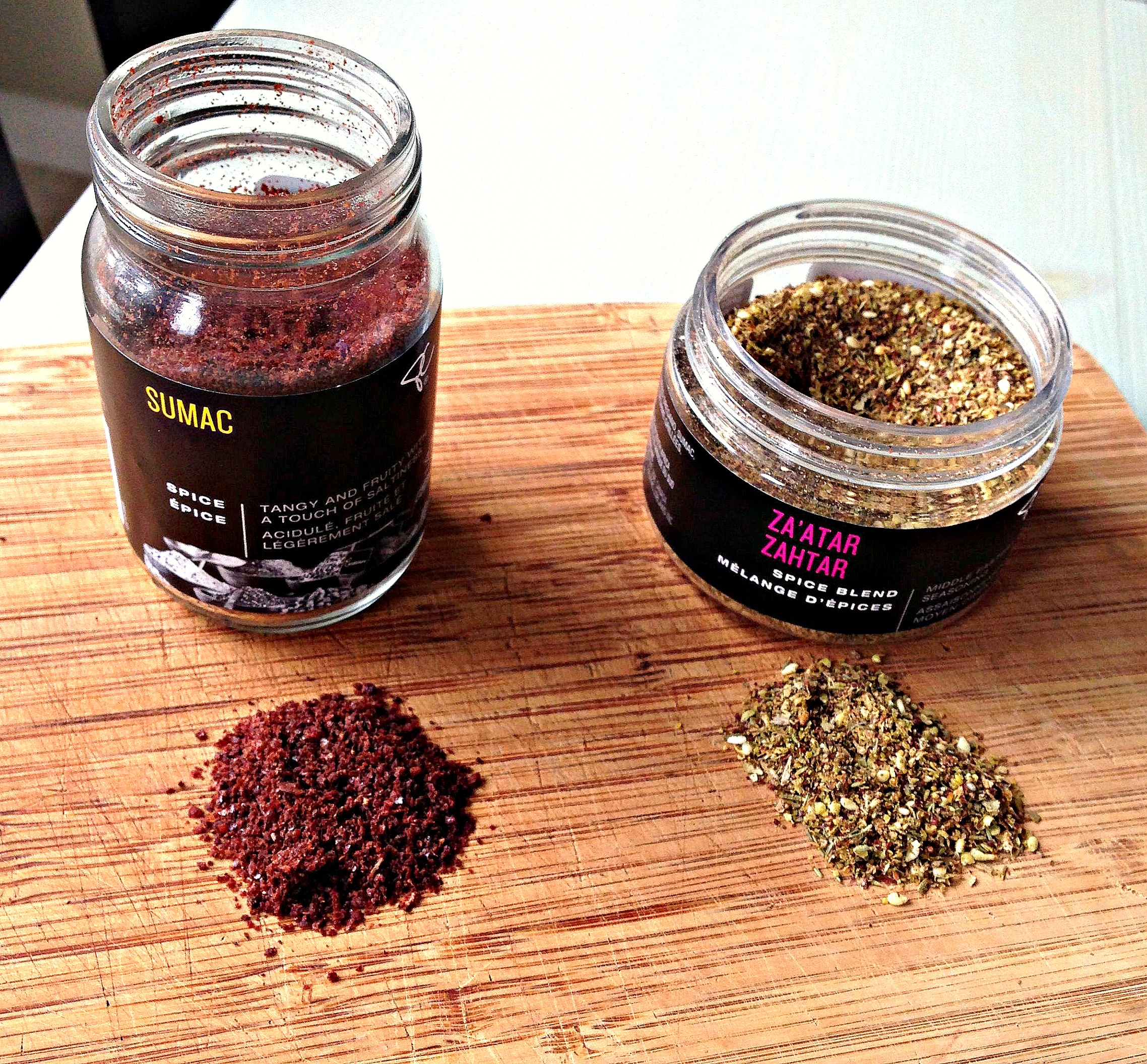 On the left is Sumac, a tangy spice that adds a lemony earthiness to the chicken. The aroma is quite intoxicating while the chicken is roasting. On the right is Za'atar. This blend has oregano, sesame seeds, savoury and sumac. Its flavour is familiar but with twist.